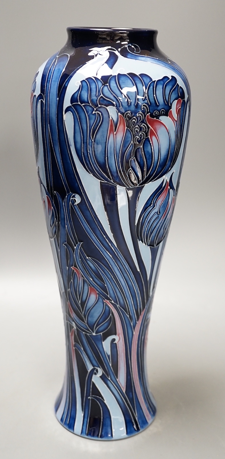 A Moorcroft 'blue tulip' vase, 2013, limited edition, 41/50, boxed, 37 cms high.